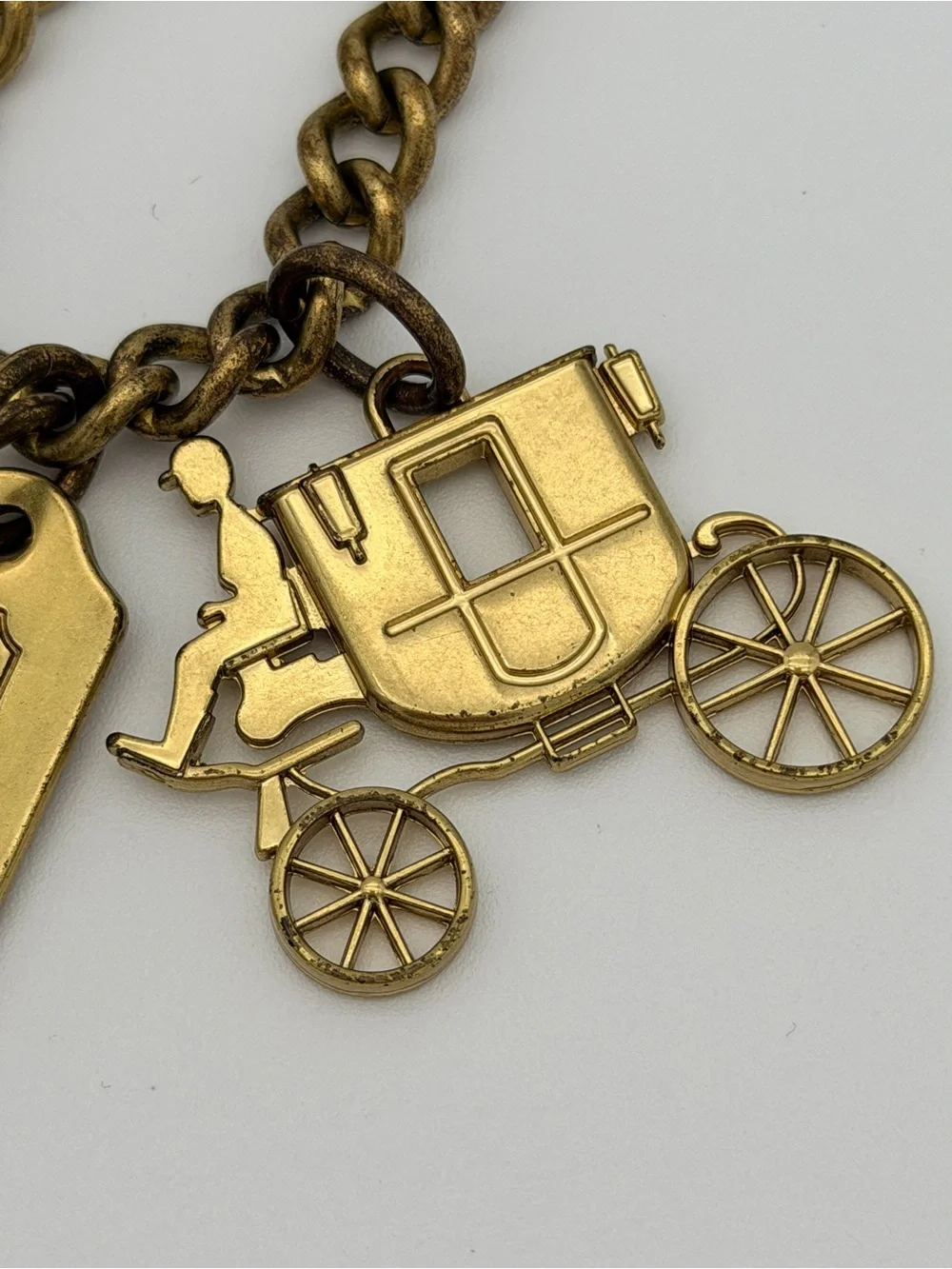 COACH Brass Charm Bracelet with Coach Tags & Horse Carriage Charm